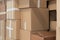 Stack of cardboard boxes ready to be shipped of a warehouse. Package storage room