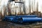 Stack of cast iron pipes in loading area waiting for transportation