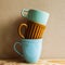 Stack of ceramic mug cups on wooden table