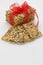 Stack Cereal cookies tied with red ribbon on a white wooden table. Rustic style. Selective focus