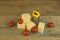 Stack cheese cubes and chery tomatoes with miniature grater on a wood kitchen table