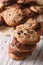 Stack of chocolate chips cookies macro on a table. Vertical