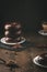 Stack of chocolate donuts on dark background. Vertical format