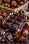 Stack of chocolate slices with mint leaf on a wooden table.Assortment of fine chocolates in white, dark, and milk chocolate. Sweet