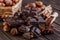 Stack of chocolate slices with mint leaf on a wooden table.Assortment of fine chocolates in white, dark, and milk chocolate. Sweet