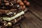 Stack of chocolate slices with mint leaf on a wooden table.Assortment of fine chocolates in white, dark, and milk chocolate. Sweet