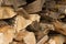 Stack of chopped firewood logs. Woodpile. Close up