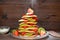 A stack of christmas tree pancakes and dripping powdered sugar