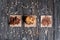 A stack of classic chocolate chip cookie and cereal chocolate on a napkin on a rustic dark table. Top view.