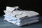 Stack of classic shirts on blue wooden table