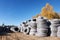 Stack of coiled plastic pvc Polyethylene Corrugated drainage pipes for sewer system outdoor warehouse