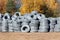 Stack of coiled plastic pvc Polyethylene Corrugated drainage pipes for sewer system outdoor warehouse