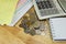 The stack of coin with calculator on wood table at office, concept of calculating expenses