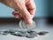 Stack coin.closeup finger woman holding money with blur pile cash