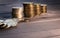 A stack of coins on a dark wooden surface. Russian metallic rubles