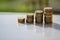 Stack of coins with reflections on the white table