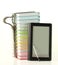 Stack of colorful books and electronic book reader