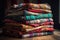 stack of colorful cloths with varying textures and patterns
