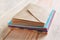 Stack of colorful envelopes on wooden table, closeup. Mail service