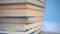 Stack of colorful hardback books on a blue bright background