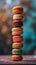 Stack of colorful macarons with bokeh background