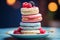 a stack of colorful macarons on a plate