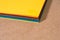 Stack of colorful paper. Blurring background. The corners of sheets of paper close-up. Back to school. Bright natural background