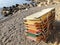 Stack colorful sunbeds on a sandy beach in summer