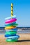 Stack of colorful swimming rings on sea beach