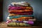 a stack of colorful textiles and fabric, ready to be made into a new project