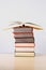 A stack of colorful thick books on a table