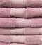 Stack of colorful towels. Fresh new fluffy towels. Pile stacked colored fabric towels. Stack colored cotton towels