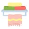 Stack of colorful towels on a metal shelf, pink towel with fringe hanging below. Home organization, bathroom accessories