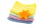 A stack of colorful towels and soap in the shape of a star-shaped folded square