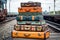 stack of colorful vintage suitcases on a train platform