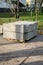 Stack of concrete road curbs in a yard for the overhaul of a sidewalk, organised by municipal public utility service.