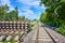 Stack of concrete sleepers and rails on a construction site on a railway line in South Berlin