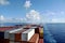 Stack of the containers loaded on aft deck of the cargo ship.