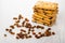 Stack of cookies with raisin, scattered dried grape on table