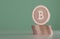 Stack of copper bitcoins as example for blockchain technology in front of blurry background