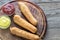 Stack of corn dogs on the wooden board