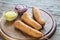 Stack of corn dogs on the wooden board