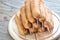 Stack of corn dogs on the wooden board