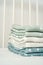 Stack of cotton blankets for a newborn in a cradle close up