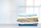 Stack of cotton colorful clothes empty space background