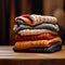 Stack of cozy autumn sweaters, perfect for chilly weather