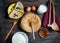 Stack of crepes and ingredients for cooking on a wooden table