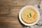 Stack of delicious crepes with melting butter and mint on wooden table, top view. Space for text