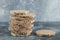 Stack of delicious crispbread on marble background