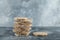 Stack of delicious crispbread on marble background